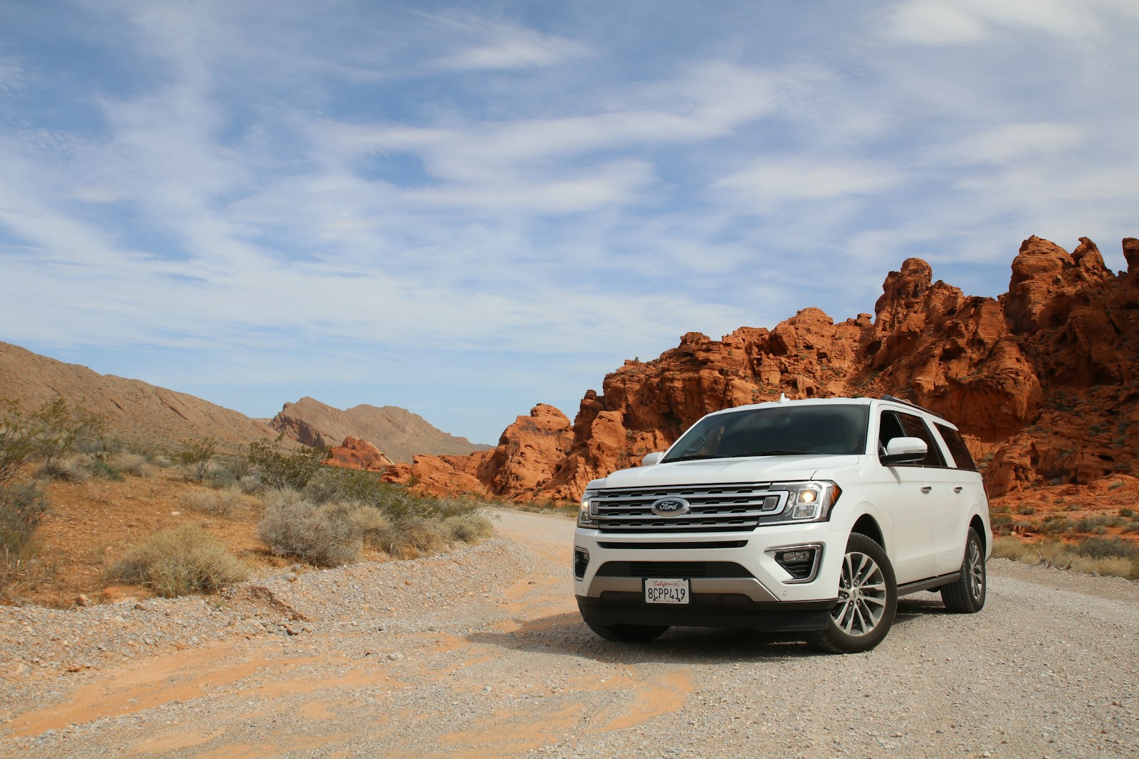 parked white Ford Explorer SUV