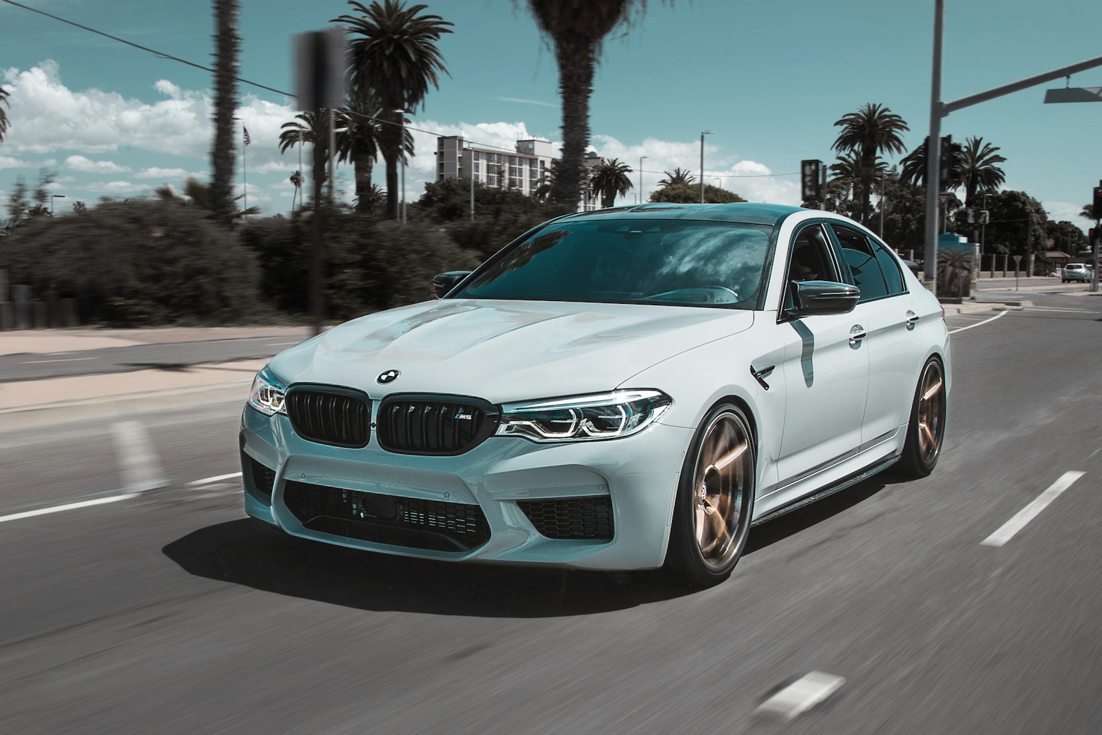 white BMW car on street auto